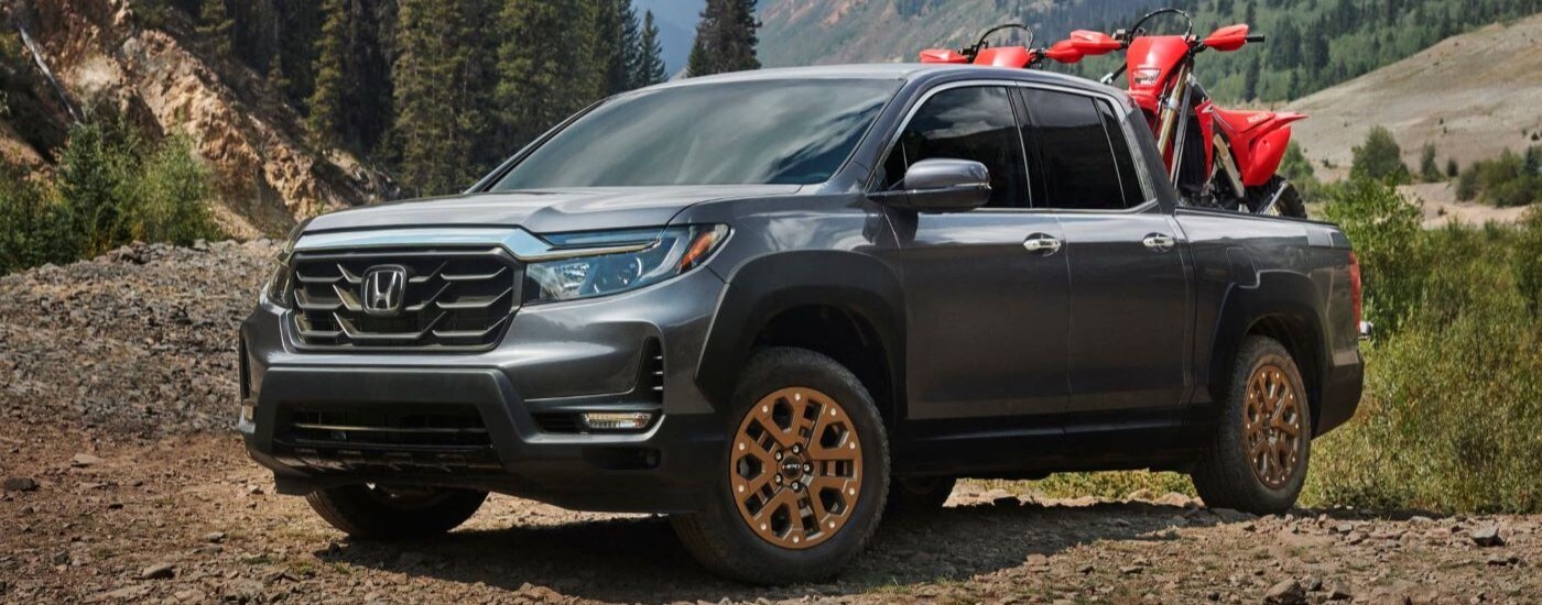 Black 2021 Honda Ridgeline HPD parked off-road.