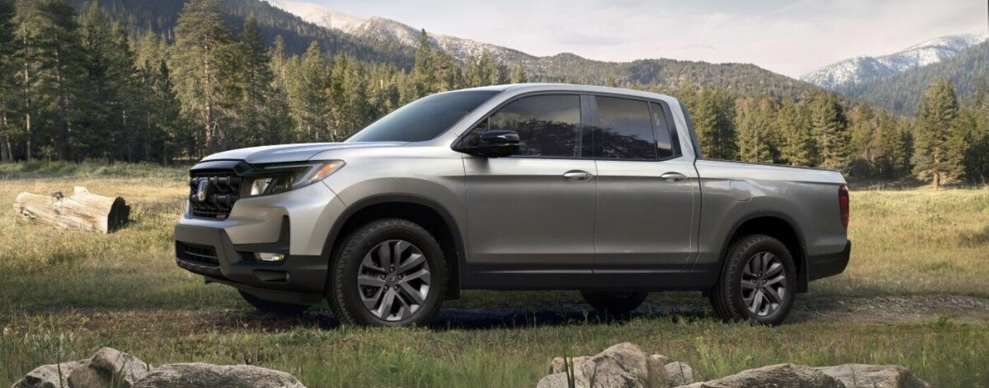 Silver 2025 Honda Ridgeline Sport parked off-road