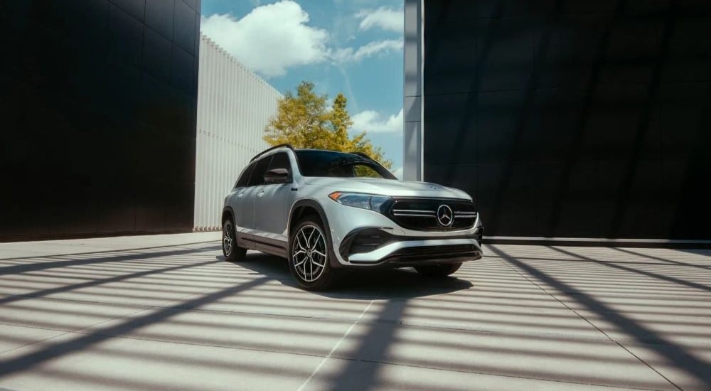 A silver 2023 Mercedes-Benz EQB is shown in a warehouse after leaving a car dealership.